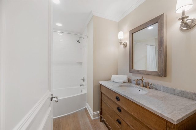 bathroom with baseboards, shower / bath combo, ornamental molding, wood finished floors, and vanity