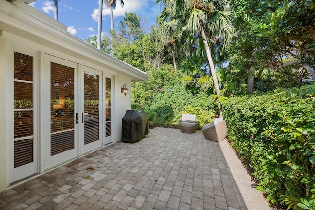 view of patio featuring french doors and a grill