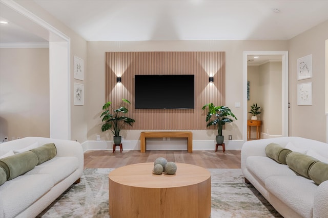 living room featuring recessed lighting, baseboards, and wood finished floors