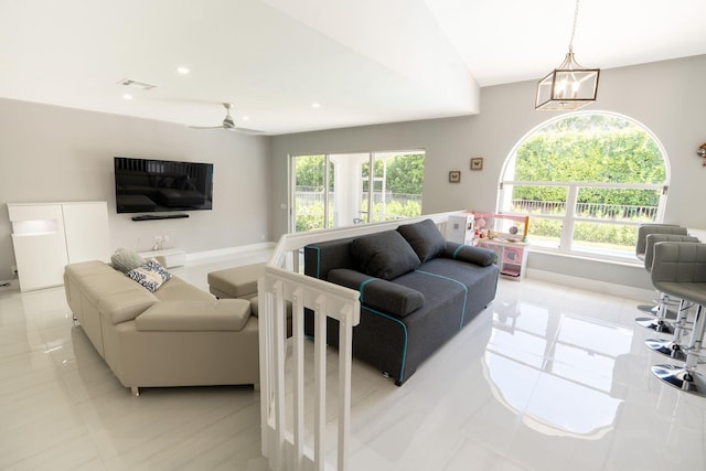 living area with ceiling fan with notable chandelier, recessed lighting, and visible vents