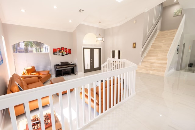 hallway with stairway, visible vents, recessed lighting, ornamental molding, and french doors