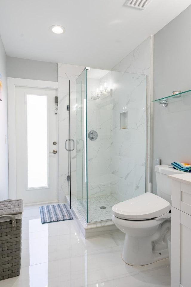 bathroom with a marble finish shower, visible vents, toilet, and vanity