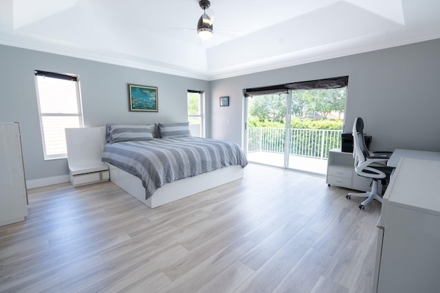 bedroom with a ceiling fan, crown molding, a raised ceiling, access to outside, and light wood-type flooring