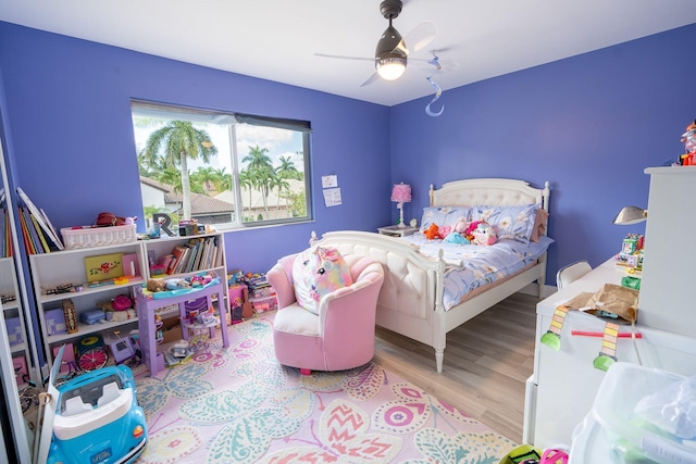 bedroom featuring a ceiling fan and wood finished floors