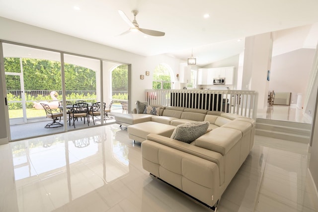 living room with light tile patterned floors, recessed lighting, a ceiling fan, and vaulted ceiling