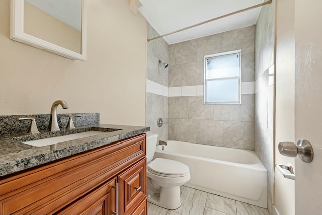 bathroom with marble finish floor, tub / shower combination, toilet, and vanity