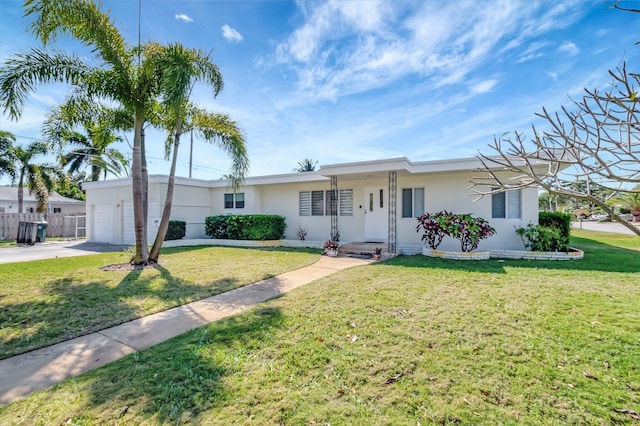 ranch-style house with stucco siding, concrete driveway, a front lawn, and fence