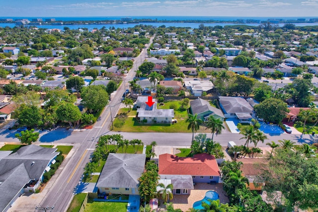 bird's eye view featuring a residential view and a water view