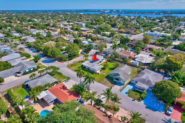 bird's eye view featuring a residential view and a water view