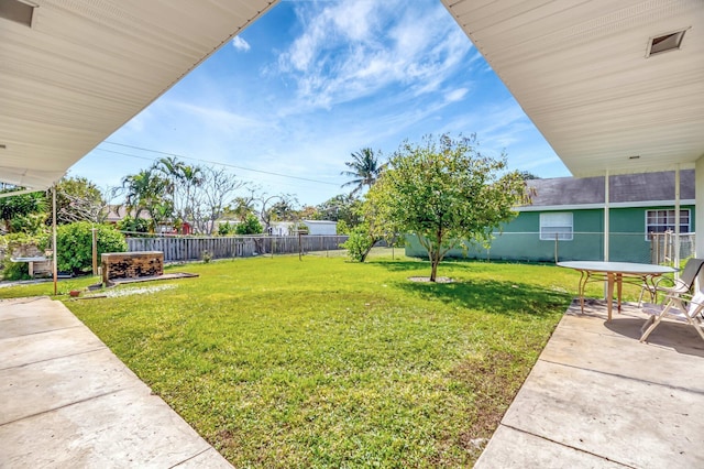 view of yard with a patio and a fenced backyard