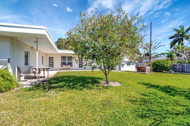 view of yard with a patio and fence