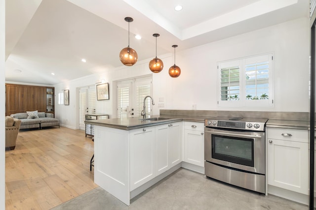 13408 55th St S, Wellington, FL 33449 - kitchen featuring open floor plan, a sink, white cabinetry, and stainless steel electric range