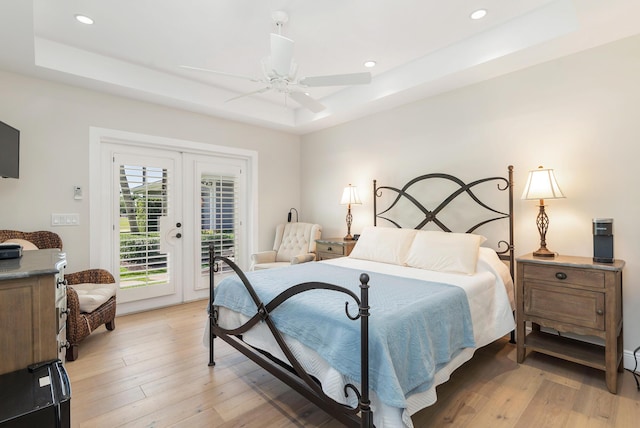 13408 55th St S, Wellington, FL 33449 - bedroom featuring access to outside, light wood-style flooring, french doors, and a raised ceiling