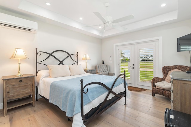 13408 55th St S, Wellington, FL 33449 - bedroom featuring access to exterior, light wood-style flooring, and a raised ceiling