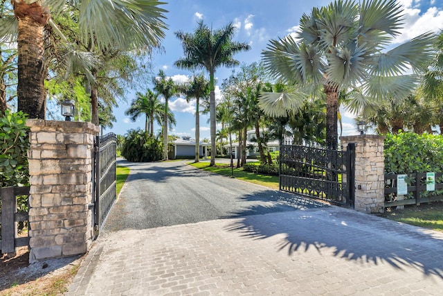 13408 55th St S, Wellington, FL 33449 - view of street featuring a gated entry, a gate, and decorative driveway