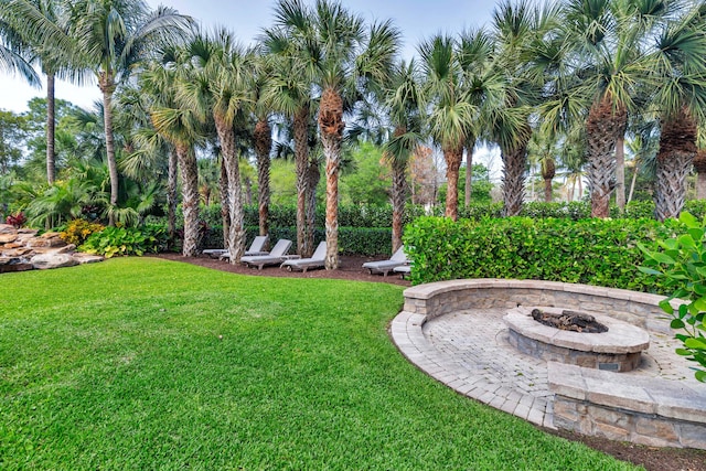 13408 55th St S, Wellington, FL 33449 - view of yard featuring an outdoor fire pit