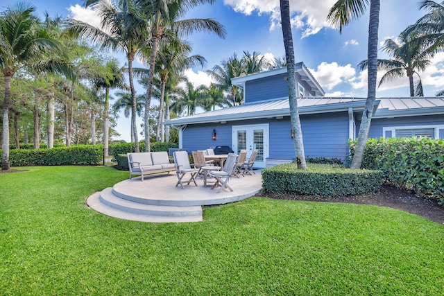 13408 55th St S, Wellington, FL 33449 - view of yard featuring french doors and a patio area