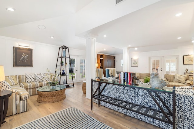13408 55th St S, Wellington, FL 33449 - living area featuring decorative columns, vaulted ceiling, french doors, wood finished floors, and recessed lighting