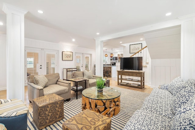 13408 55th St S, Wellington, FL 33449 - living area with french doors, decorative columns, recessed lighting, and light wood-type flooring