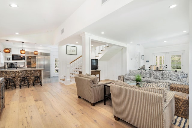 13408 55th St S, Wellington, FL 33449 - living area featuring visible vents, stairs, recessed lighting, lofted ceiling, and light wood-style floors