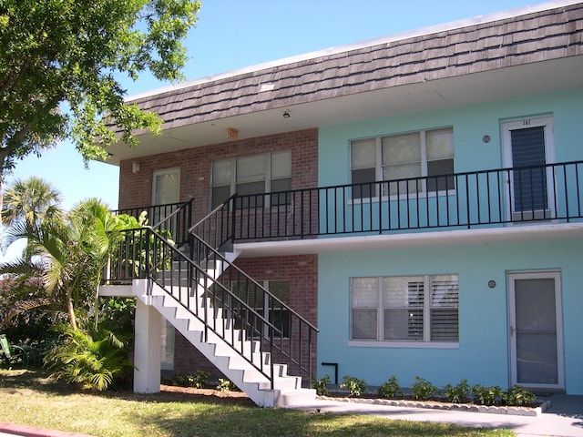 view of building exterior with stairs