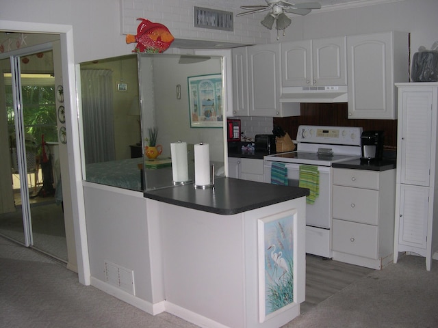 kitchen with visible vents, white range with electric cooktop, white cabinets, under cabinet range hood, and dark countertops