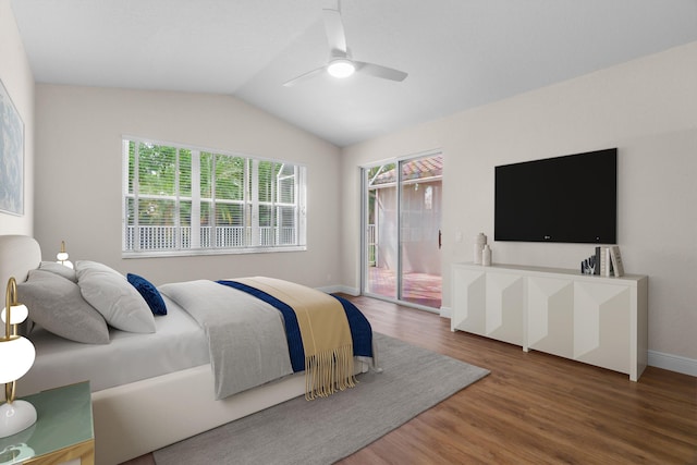 bedroom featuring access to exterior, baseboards, lofted ceiling, wood finished floors, and a ceiling fan