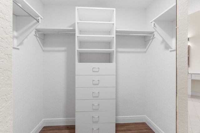 walk in closet featuring wood finished floors