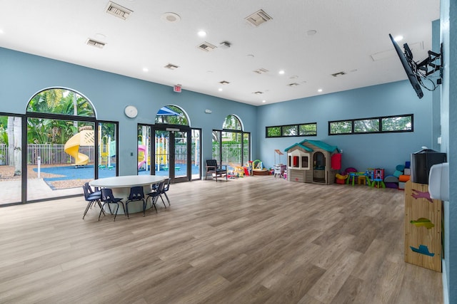 recreation room with visible vents and wood finished floors