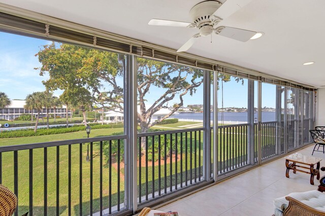 1 Church Ln Unit 111, North Palm Beach, FL 33408 - sunroom / solarium featuring a wealth of natural light, recessed lighting, tile patterned flooring, and a water view