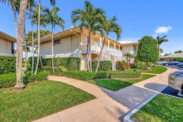 1 Church Ln Unit 111, North Palm Beach, FL 33408 - exterior space with a front yard and stairs