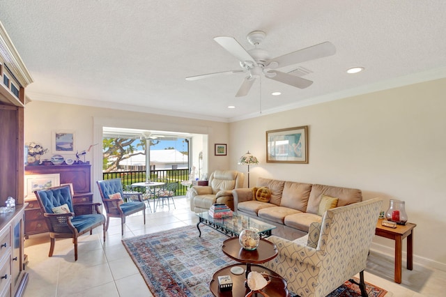 1 Church Ln Unit 111, North Palm Beach, FL 33408 - living room with ornamental molding, light tile patterned flooring, a ceiling fan, and visible vents