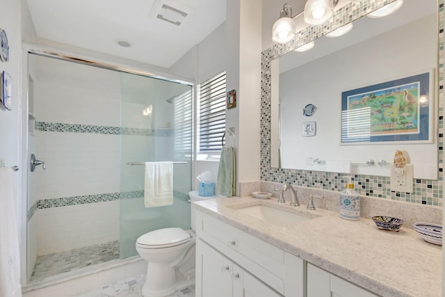 1 Church Ln Unit 111, North Palm Beach, FL 33408 - bathroom with visible vents, toilet, a stall shower, and vanity