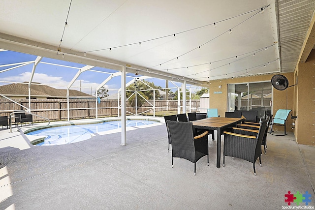 view of swimming pool with outdoor dining space, a patio, a fenced backyard, glass enclosure, and a fenced in pool