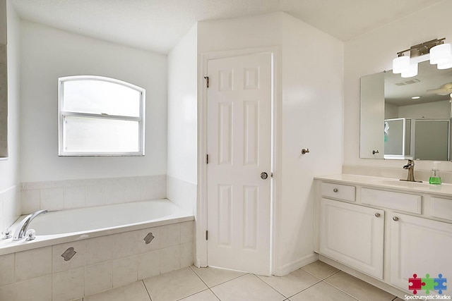 bathroom with visible vents, a stall shower, tile patterned flooring, a bath, and vanity