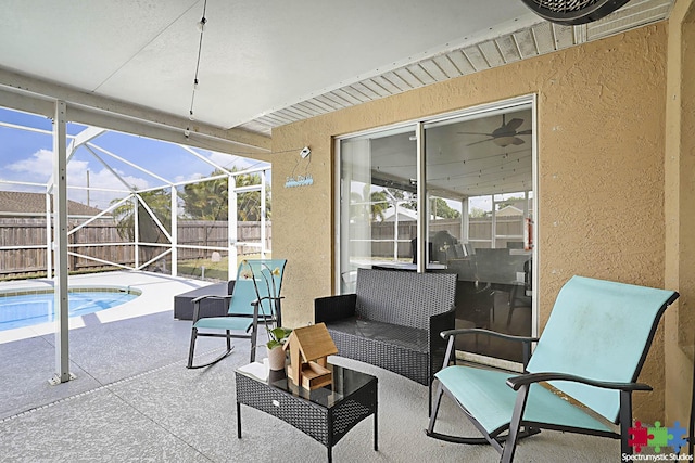 view of patio / terrace featuring a lanai, a fenced in pool, and a fenced backyard