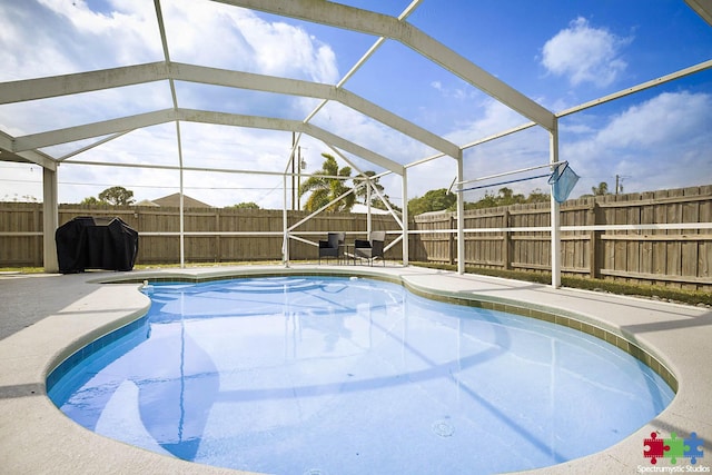 view of pool featuring a fenced in pool, a lanai, a fenced backyard, area for grilling, and a patio