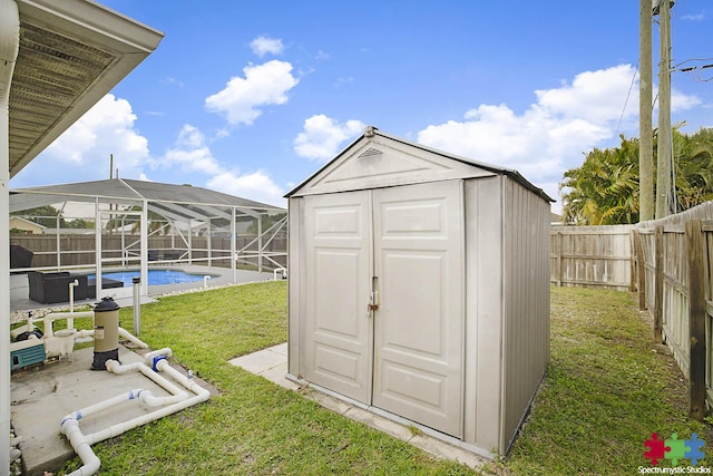 view of shed with a fenced backyard and a fenced in pool