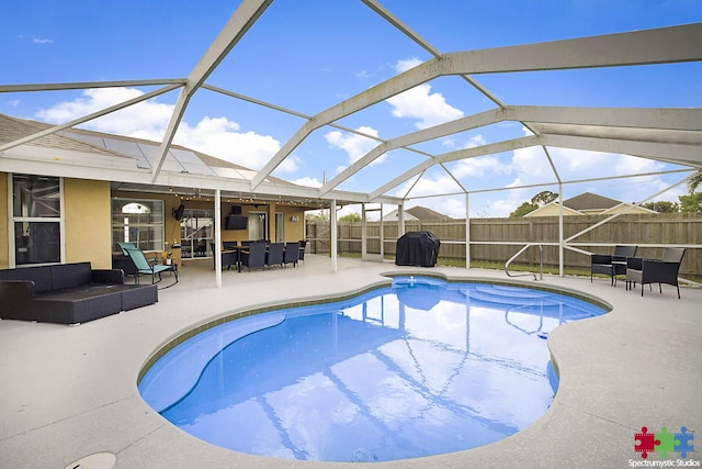 view of pool featuring a fenced in pool, a lanai, outdoor lounge area, a fenced backyard, and a patio area