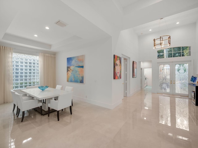 dining room with baseboards, visible vents, a tray ceiling, recessed lighting, and french doors