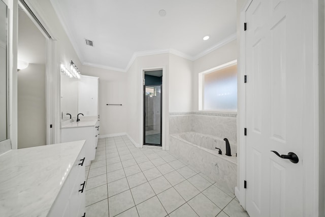 bathroom with vanity, visible vents, ornamental molding, tile patterned flooring, and a garden tub