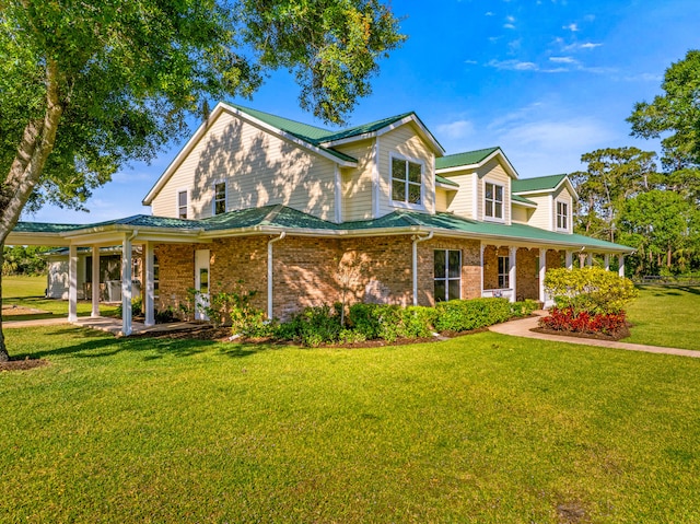 farmhouse inspired home with brick siding and a front lawn