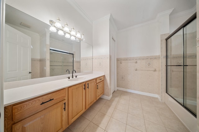 full bath with vanity, crown molding, tile patterned floors, and wainscoting