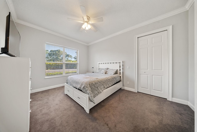 bedroom featuring crown molding, baseboards, and dark colored carpet