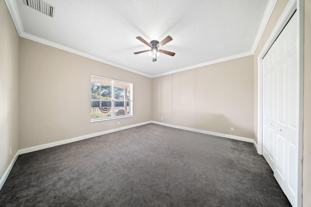 unfurnished bedroom with visible vents, baseboards, a closet, and crown molding