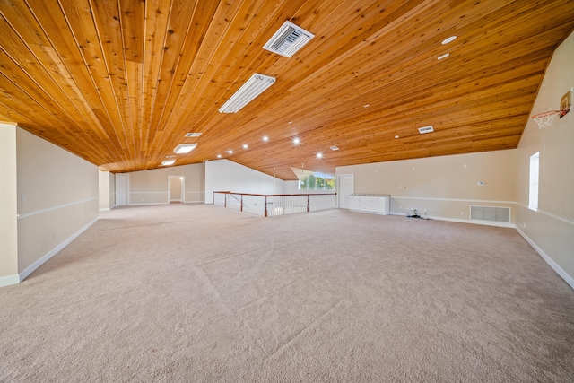 additional living space featuring vaulted ceiling, wood ceiling, and visible vents