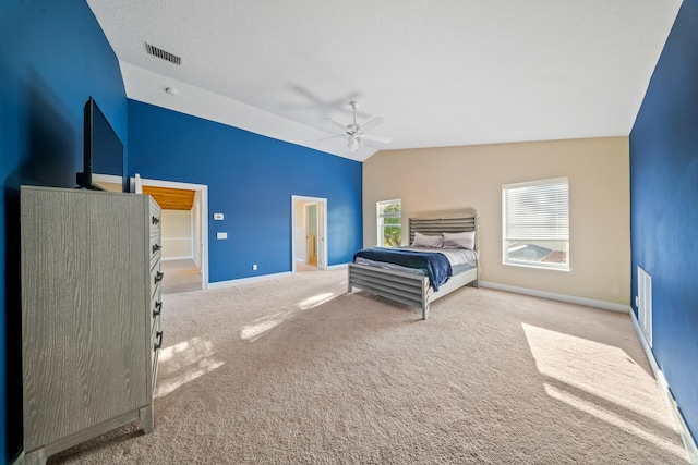 carpeted bedroom featuring baseboards, visible vents, lofted ceiling, ceiling fan, and a textured ceiling