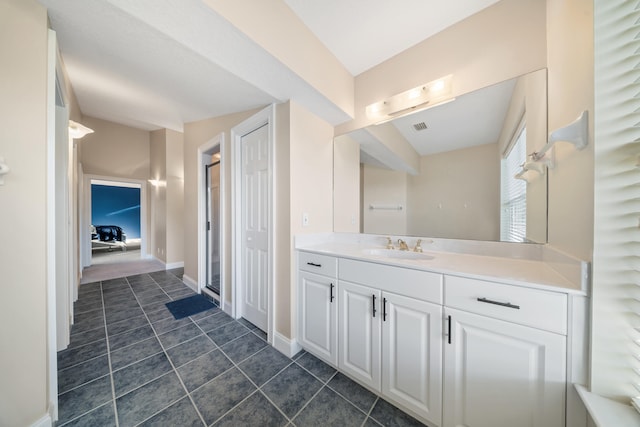 bathroom with tile patterned flooring, visible vents, vanity, and baseboards