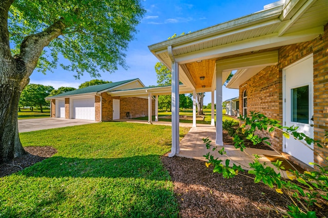 view of yard with driveway, covered porch, and an attached garage