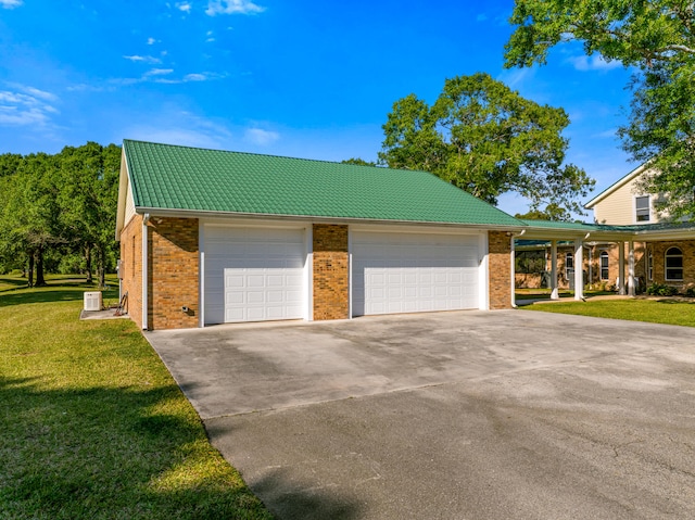 exterior space with driveway, a front yard, a garage, brick siding, and a tiled roof